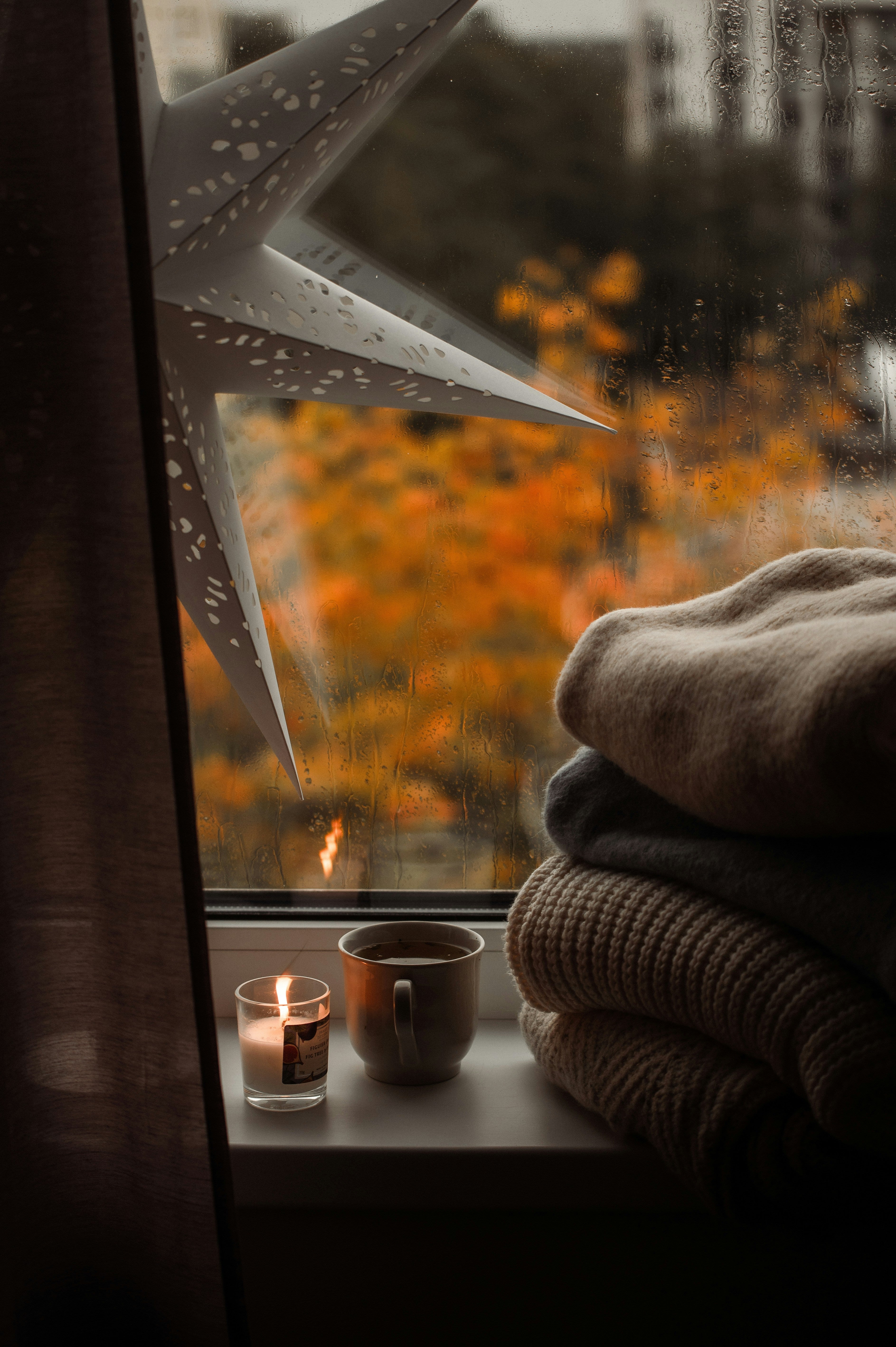 Lit candle burning cleanly in a cozy setting