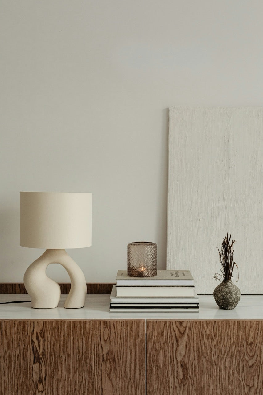 Cozy home scene with candle and warm styling